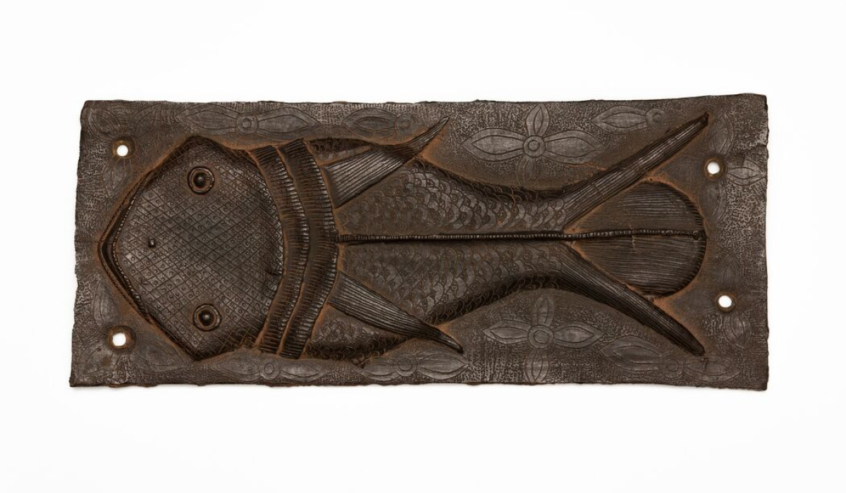Ama O Ghe Ehen (Fish Plaque), 18th Century, Brass(bronze), 43 x 18 cm. Court of the Oba of Benin, Nigeria. Courtesy of the NCMM, on behalf of the Oba of Benin. Photograph by Martijn Schmidt.